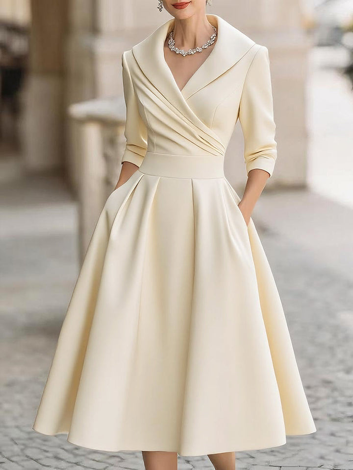 Women's special occasion midi dress; elegant A-line cut, long sleeve, and distinctive draped collar.
