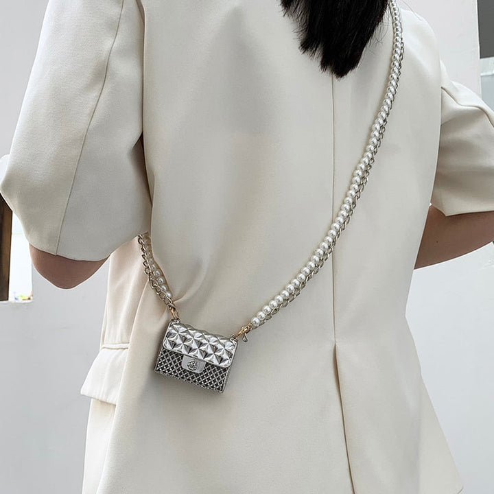 Metallic women's mini clutch purse with elegant rhinestones, ideal for evening wear.