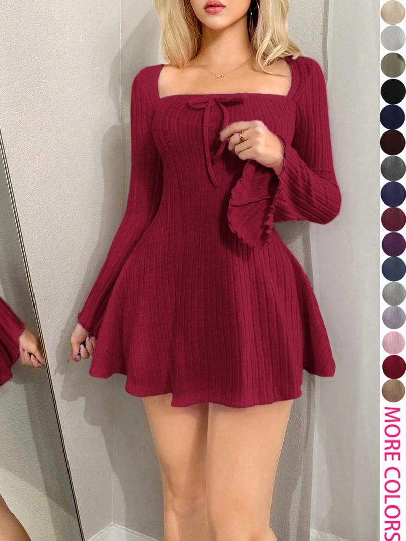 Flattering ribbed bodycon midi dress for women, featuring long sleeves and a stylish tie waist detail.