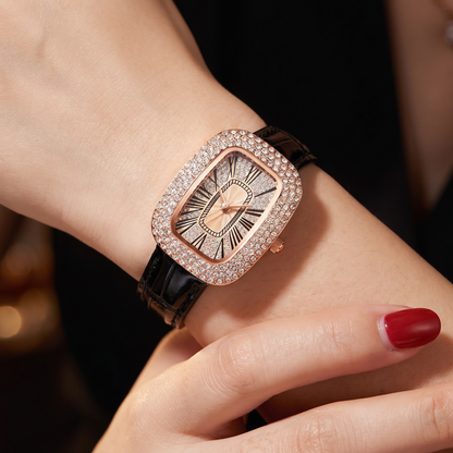 Luxurious rose gold women's watch, rectangular dial, shimmering crystal bezel.