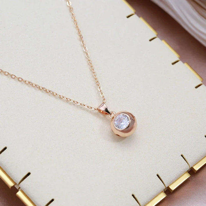 Shimmering rose gold zircon orb stud earrings for women, minimalist and elegant set.