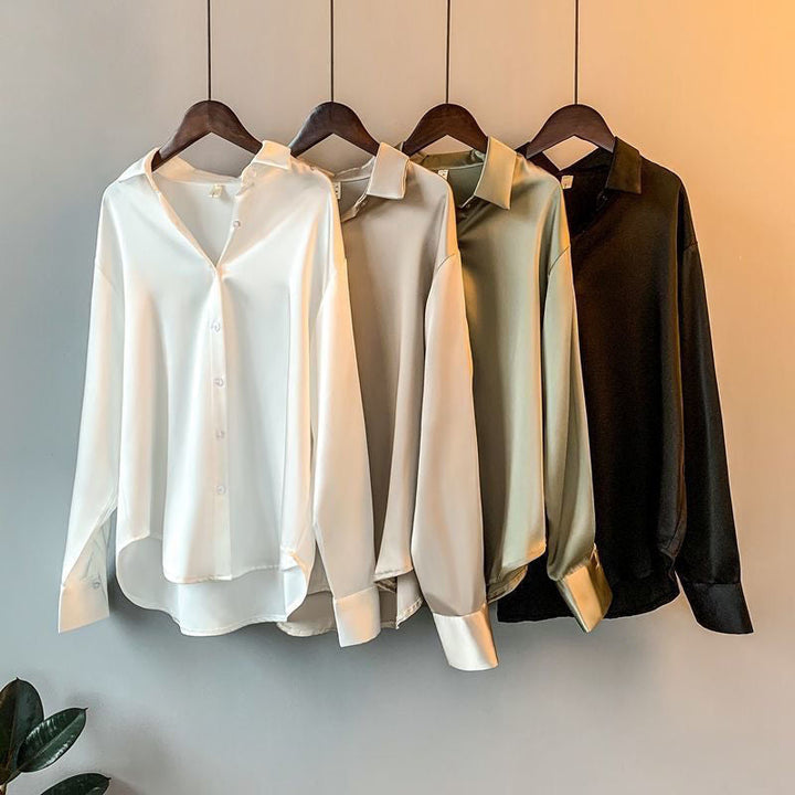 Women's long sleeve ruffle blouse in elegant fabric. Sophisticated design for office or chic casual wear. Flowy fit.