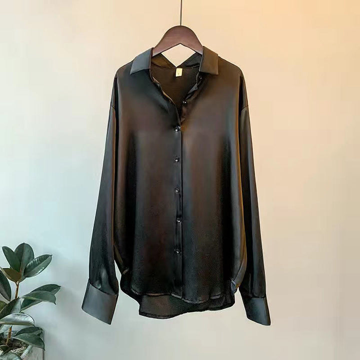 Effortless chic women's ruffle blouse. Comfortable long sleeve top, ideal for versatile workwear or stylish casual outfits.