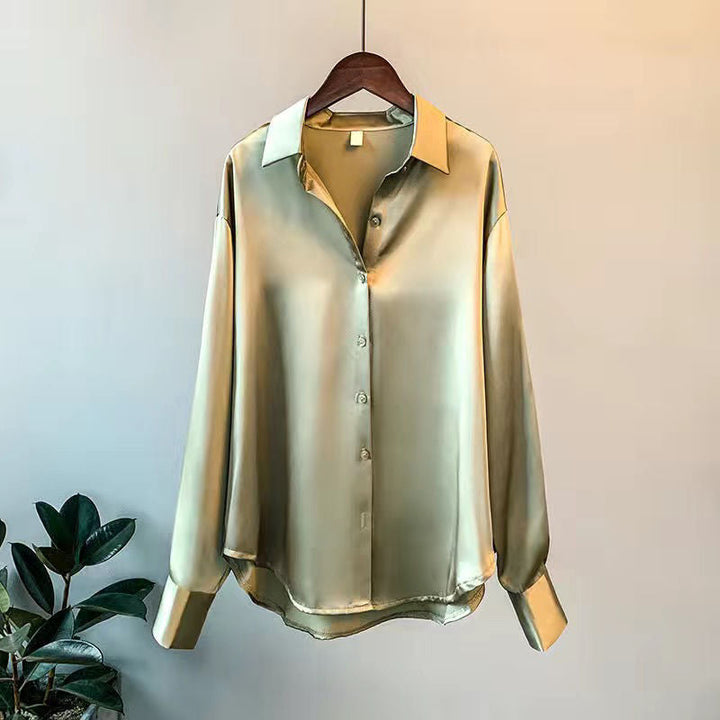 Fashionable women's elegant ruffle blouse. Long sleeve top, perfect for sophisticated workwear & chic casual wear. Flowy design.