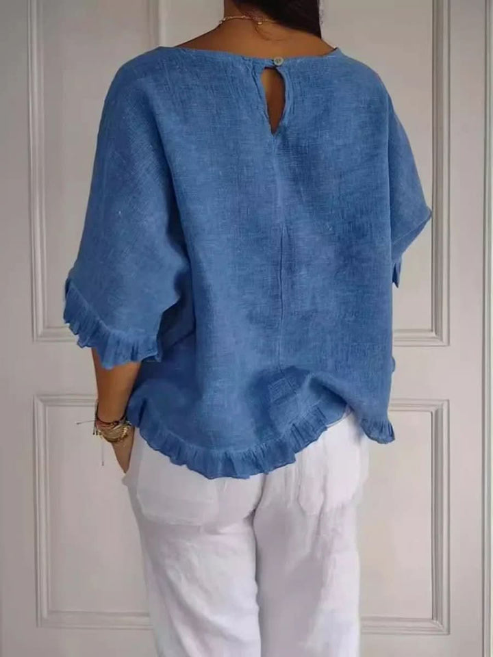 Feminine elegant blouse with ruffles, ideal for versatile styling.