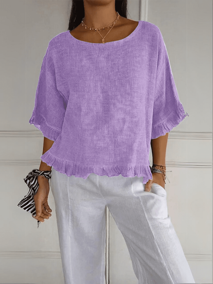 Comfortable women's ruffle blouse, a feminine and chic top for daily wear.