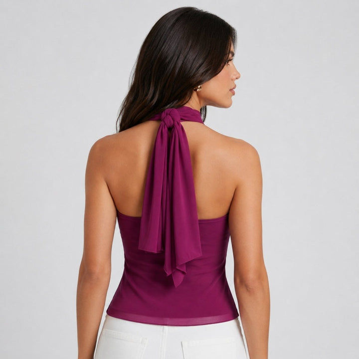 Dressy women's sleeveless halter blouse with delicate ruffles, ideal for evening wear.