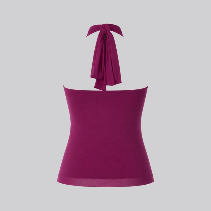 Stylish women's sleeveless blouse with ruffle details and halter neck for formal wear.