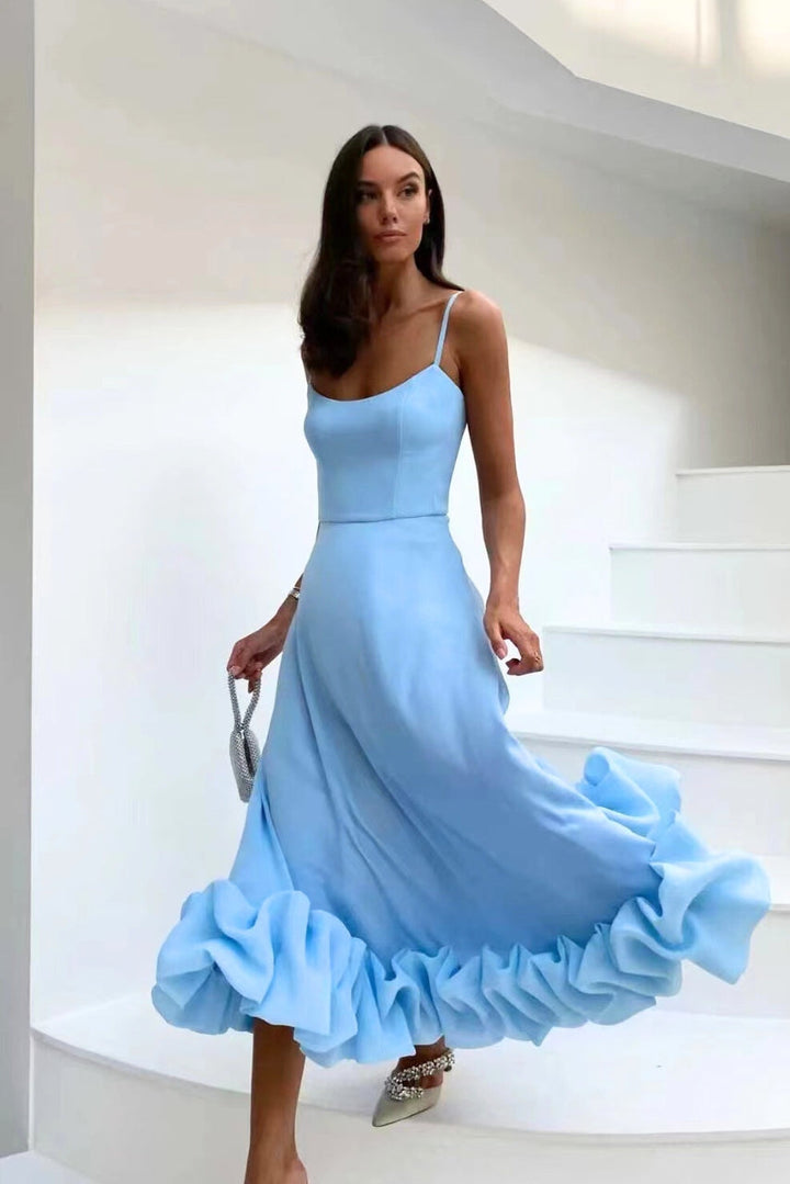 Women's formal maxi homecoming dress with a stylish ruffle hem and delicate spaghetti straps.