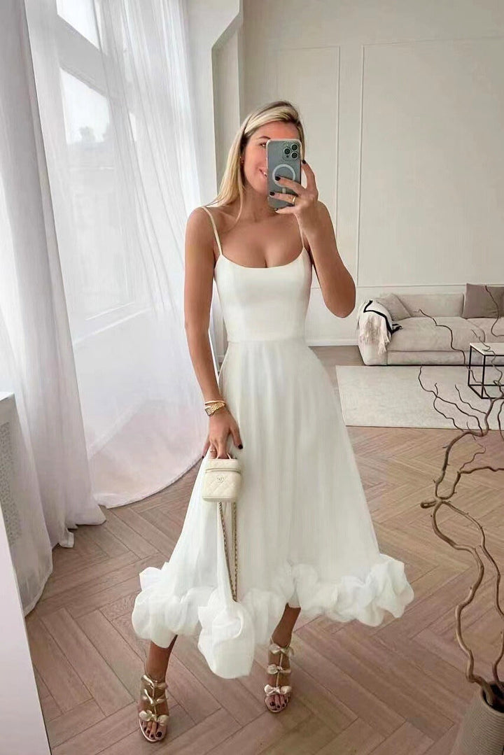 Sophisticated women's maxi dress with ruffle hem, suitable for homecoming, proms & special occasions.