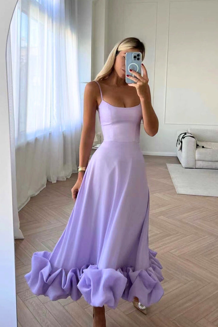 Women's elegant ruffle hem maxi gown, spaghetti strap design for homecoming or evening wear.