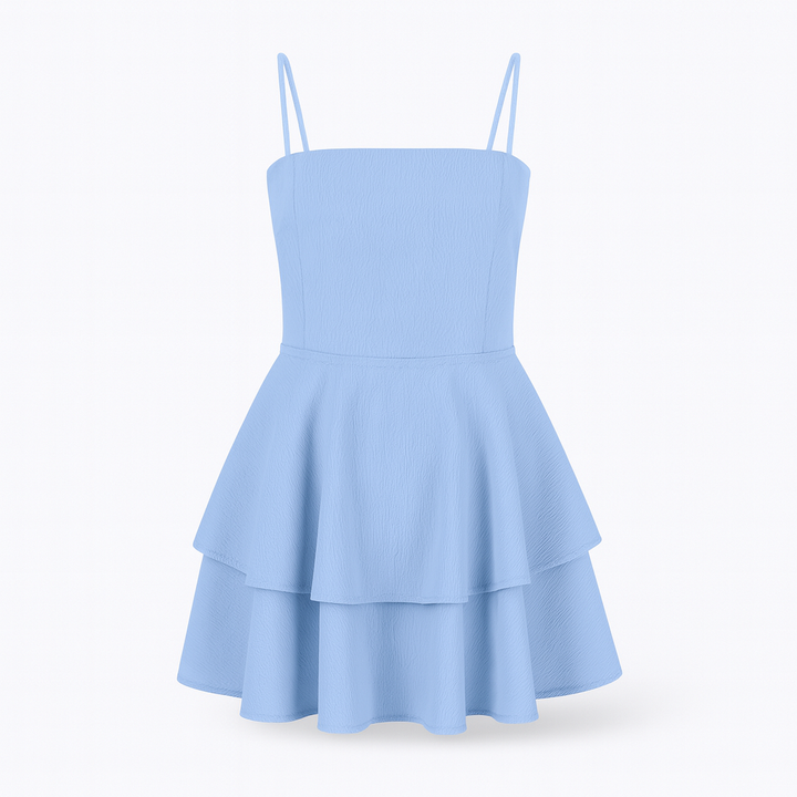 Beautiful women's elegant mini dress featuring playful ruffles and delicate spaghetti straps.