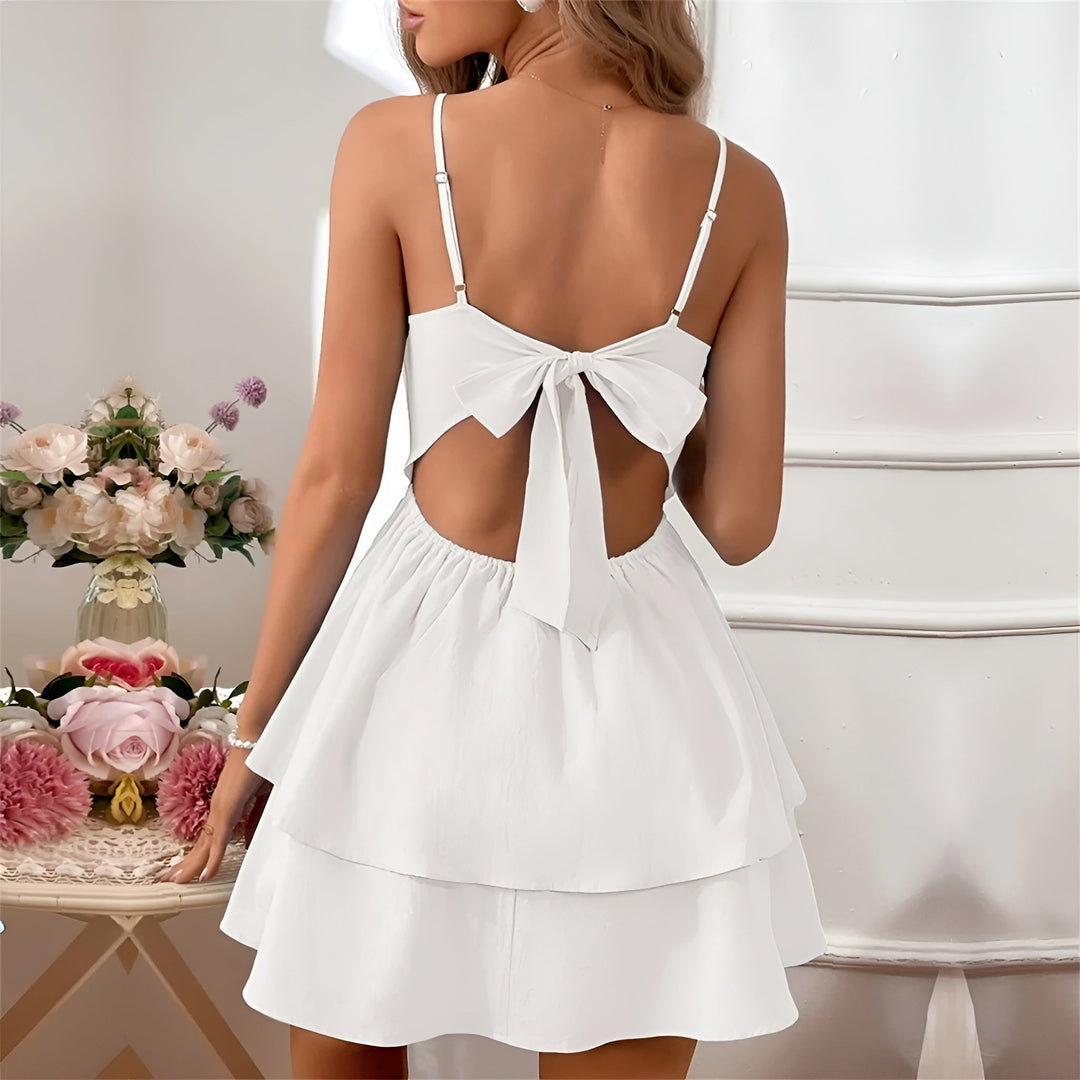 Women's chic A-line ruffle mini dress, perfect for warm weather with spaghetti straps.