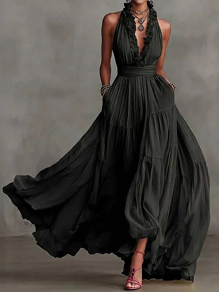 Stunning women's backless maxi dress with ruffle trim & plunging neckline. Ideal party or special occasion gown.