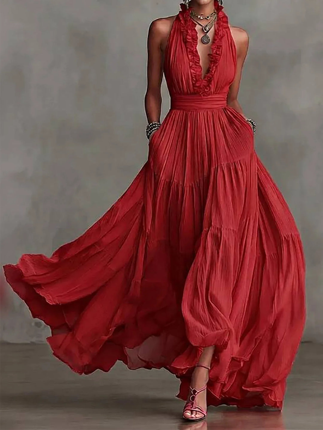 Chic women's formal evening gown: ruffle trim, plunging V-neck, & pleated maxi skirt. Great for parties.