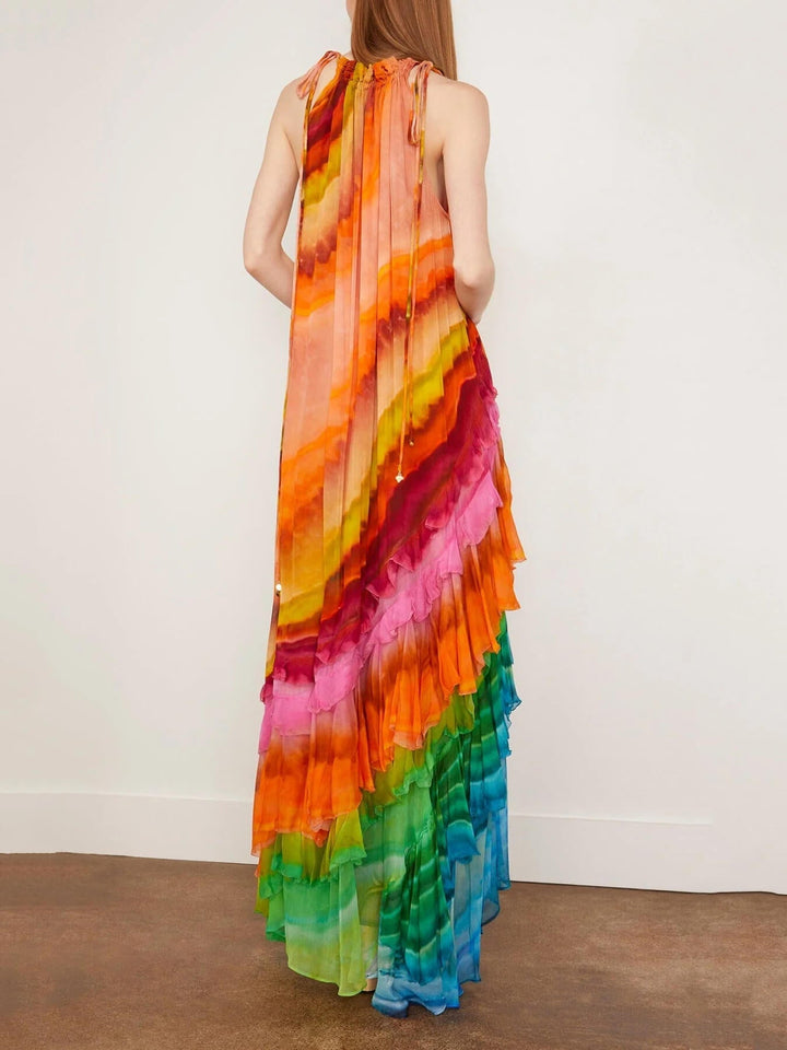 Stylish women's sleeveless ruffled maxi dress with a halter neckline. Ideal elegant and flowy summer special occasion wear.