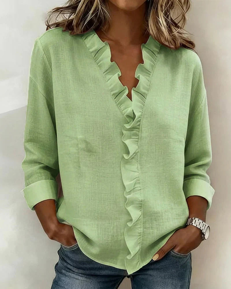 Women's versatile ruffled V-neck long sleeve blouse styled for a casual chic look, perfect for everyday wear.