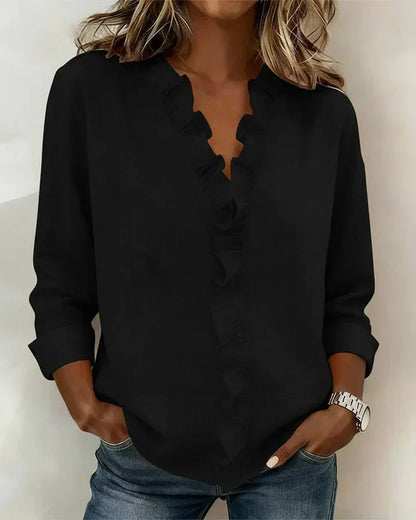 Back view of a comfortable women's ruffled V-neck long sleeve blouse, highlighting versatile and elegant design.
