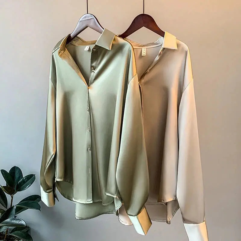 Close-up view of Satiana women's blouse. Elegant fabric & long sleeves, ideal for stylish workwear & daily outfits.