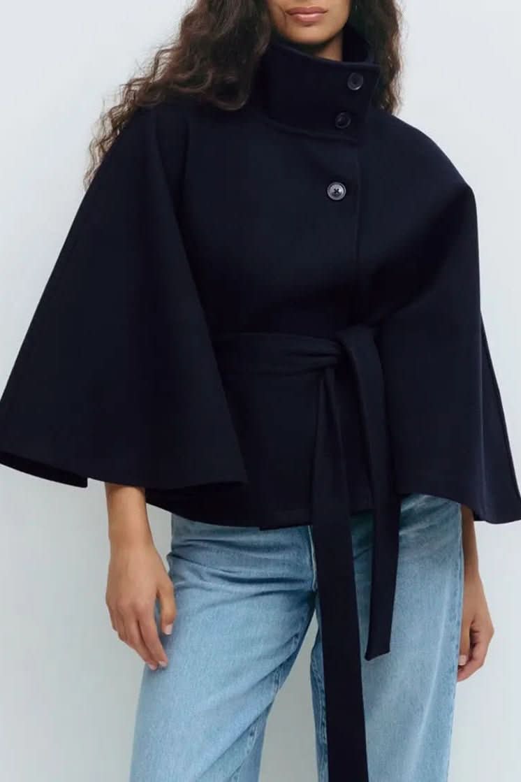 Fashionable women's oversized cape with a self-tie closure, ideal for stylish and versatile layering.