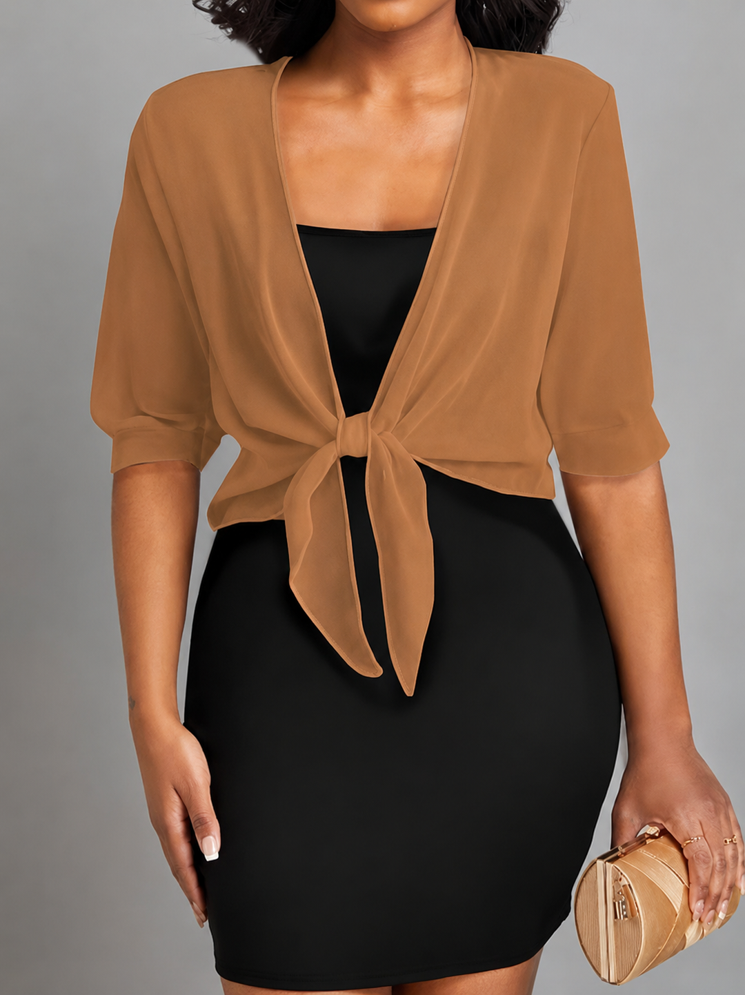 Women's elegant sheer cropped bolero with tie front detail, offering chic and versatile layering options.