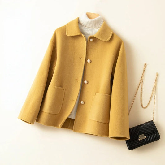 Elegant women's short winter coat. Classic design, perfect outerwear for a chic and sophisticated look.