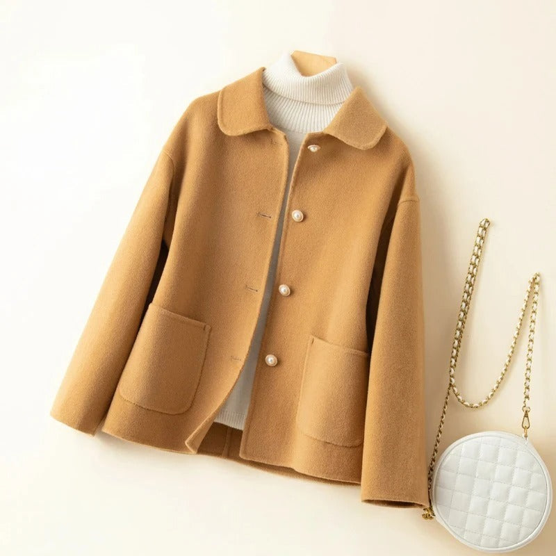 Sophisticated beige women's short winter coat. Classic outerwear for an elegant autumn fashion statement.