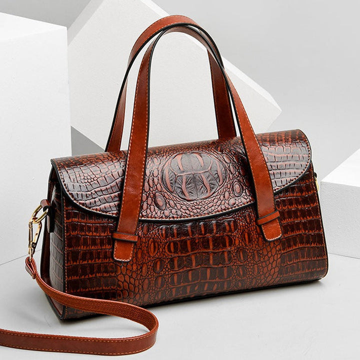 Versatile women's crocodile embossed crossbody bag. Stylish handbag accessory for any occasion.