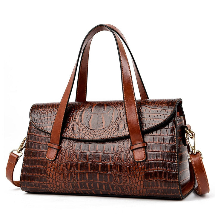 Women's stylish handbag with a luxurious crocodile embossed texture. A chic and versatile accessory.