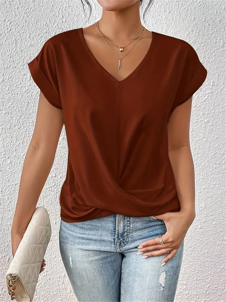 Stylish women's twist-front V-neck top. Silky short sleeve blouse, great for an elegant or casual chic look.