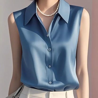 Lightweight elegant women's sleeveless summer blouse. Button-down, tailored collared top perfect for chic professional wear.