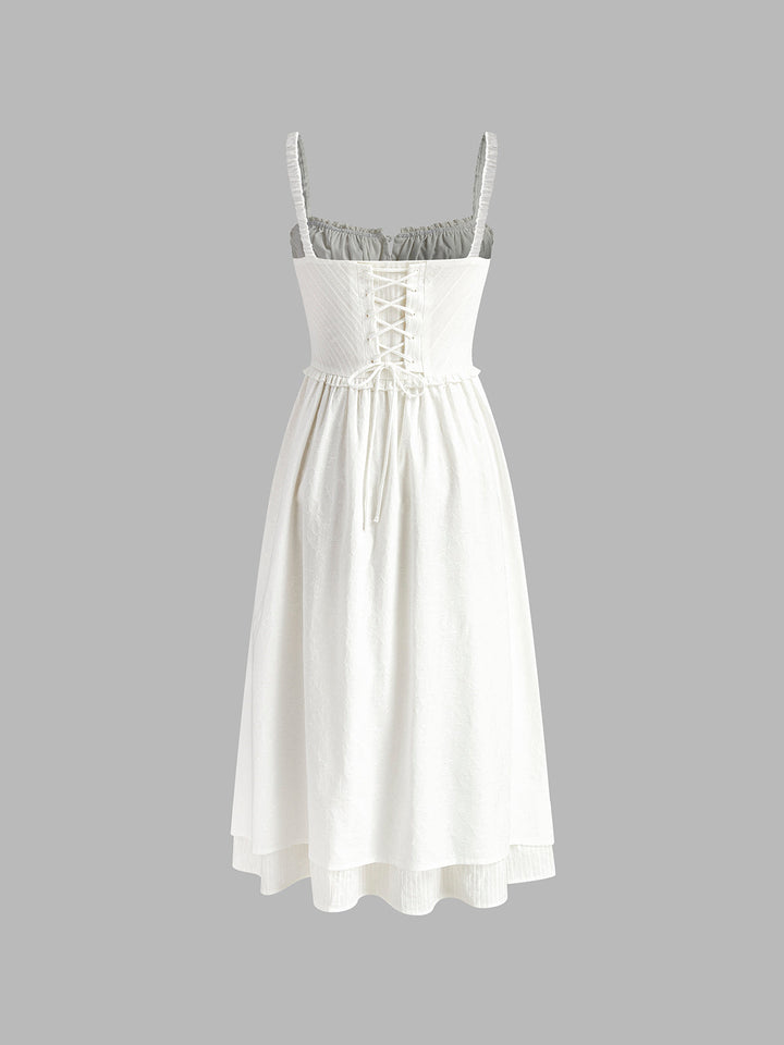 Sleeveless women's midi dress with a distinctive ruffle hem, perfect for an elegant casual look.
