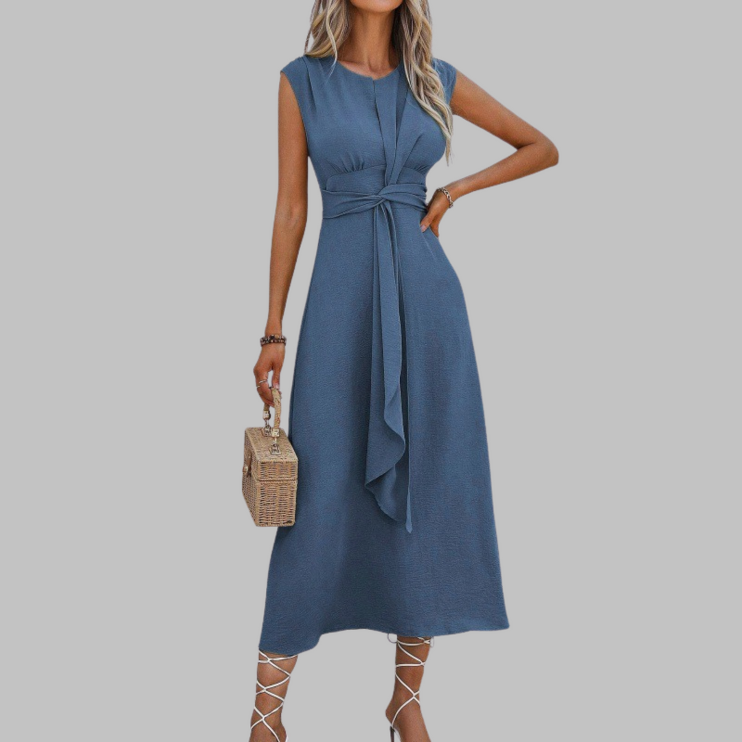 Versatile flowy long sleeveless dress with a round neck, elegant for women's summer or evening wear.