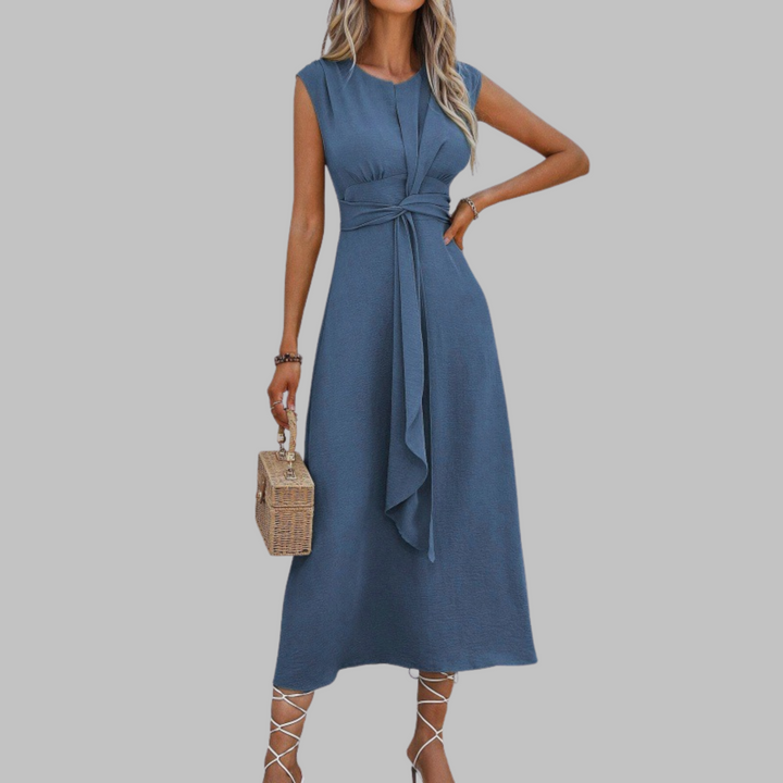 Versatile flowy long sleeveless dress with a round neck, elegant for women's summer or evening wear.