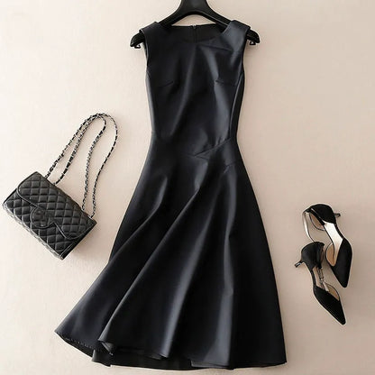 Chic navy sleeveless tailored dress for women. Modern, elegant, and versatile for business or casual wear.