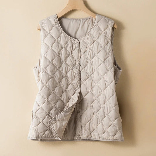 Elegant women's sleeveless vest for chic layering, minimalist style. A perfect fashion piece.
