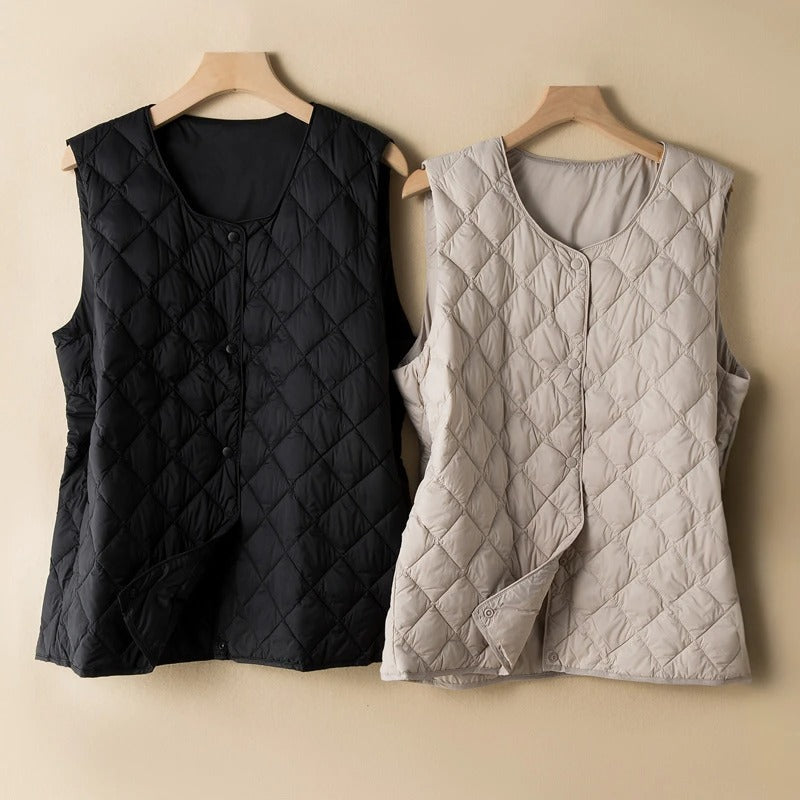 Stylish black women's sleeveless vest, perfect for chic layering. Elegant fashion top, minimalist design.