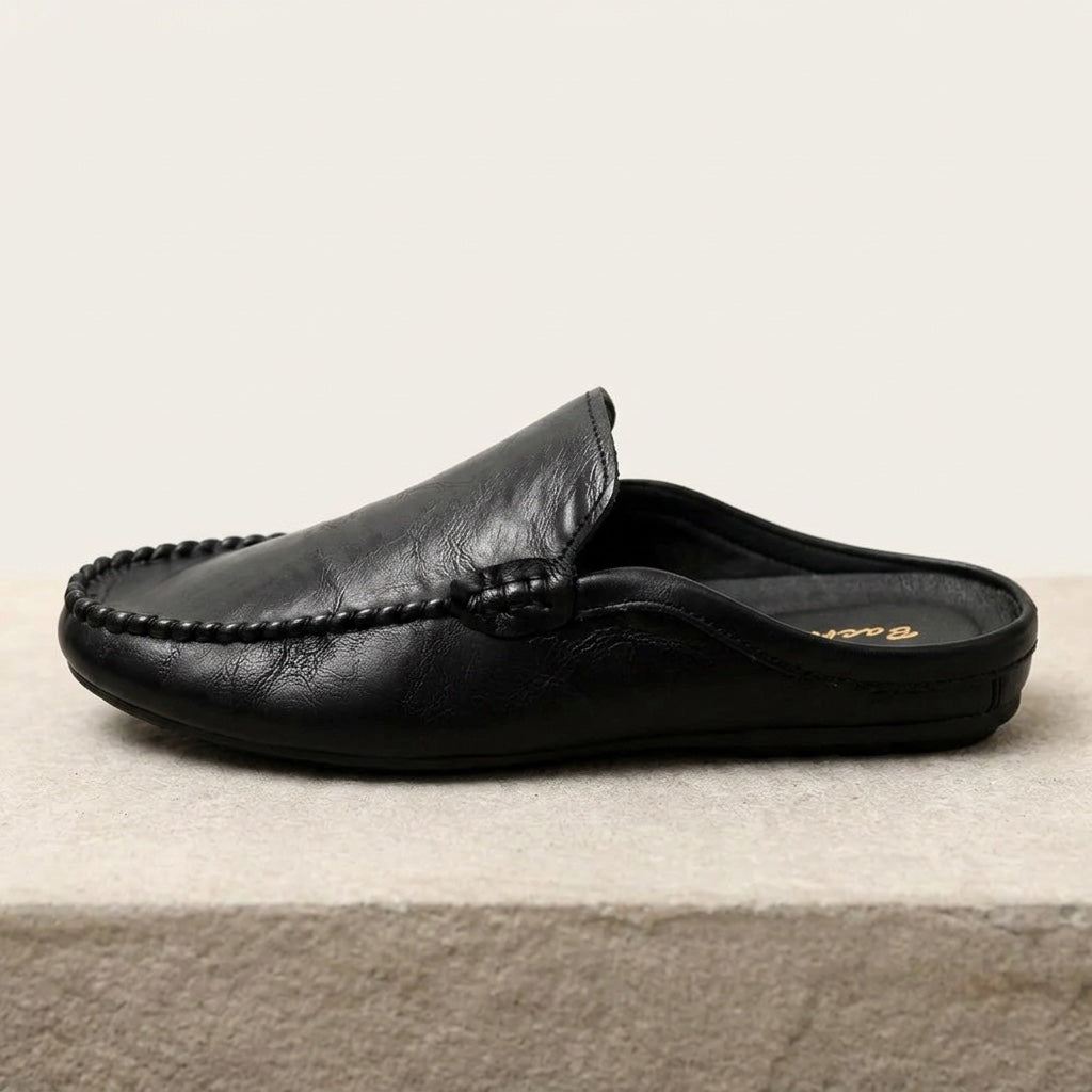Modern women's open-toe mules. Elegant slip-on flat loafers for summer comfort and effortless casual style.