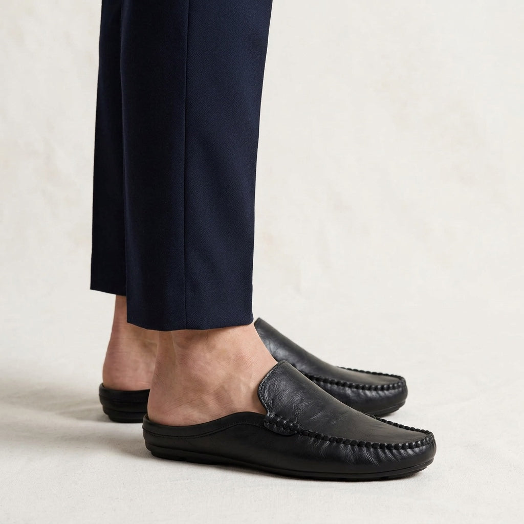 Women's elegant mule loafers. Slip-on flat shoes with an open-toe design, ideal for comfortable summer wear.