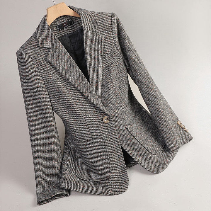 Professional women's speckled tweed jacket. Fashionable outerwear, ideal for office or elegant smart casual looks.