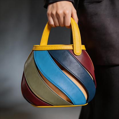 Sophisticated women's spiral cage bucket bag, unique design, elegant top-handle handbag.