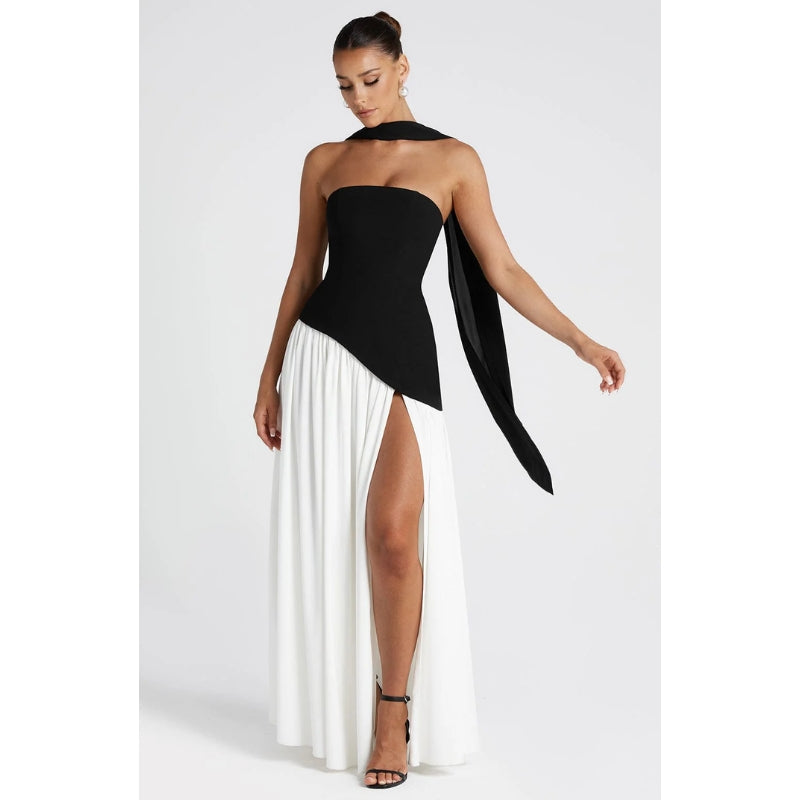 Stylish women's flowing maxi dress, strapless and asymmetric, suitable for parties.