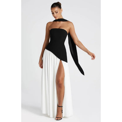 Stylish women's flowing maxi dress, strapless and asymmetric, suitable for parties.