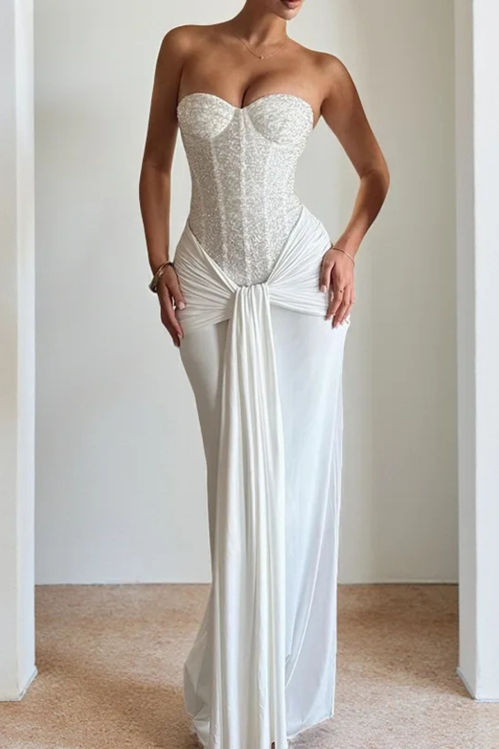 Luxurious fabric of a women's elegant strapless corset mermaid maxi dress, an evening gown.