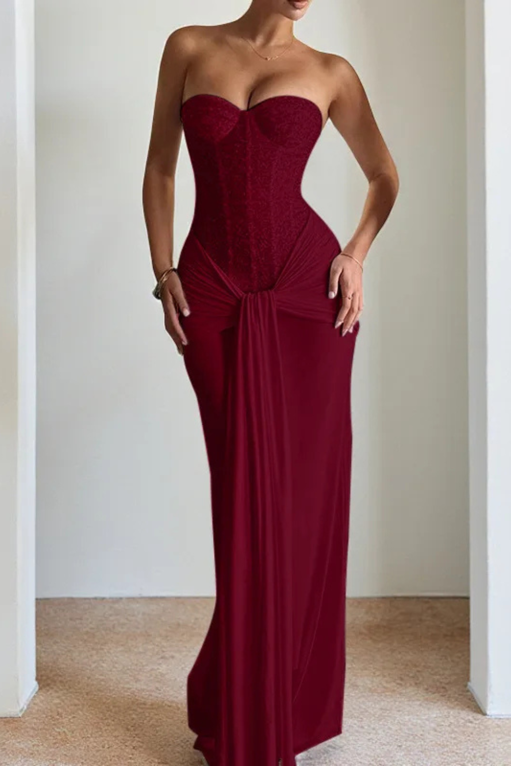 Flattering mermaid silhouette of a women's strapless corset maxi dress, perfect as a formal gown.