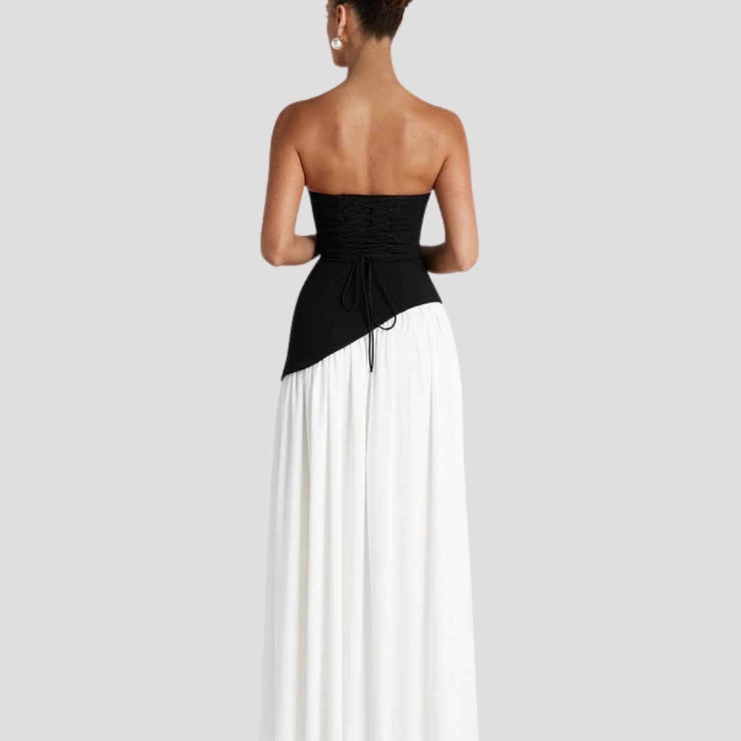 Modern women's strapless pleated maxi gown, sophisticated formal evening wear.