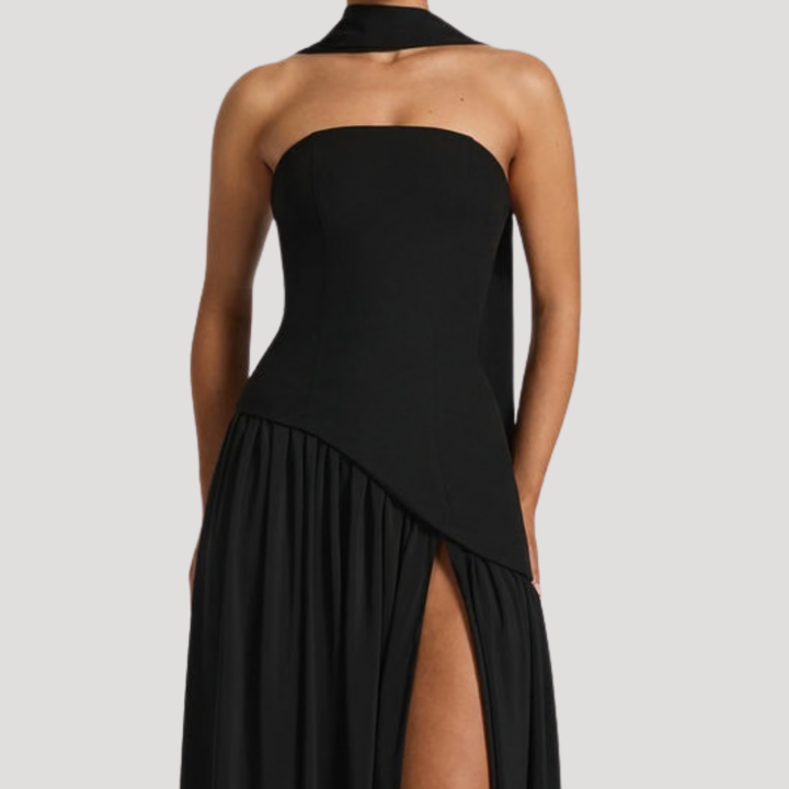 Classic women's strapless pleated maxi gown, sophisticated black-tie event dress.