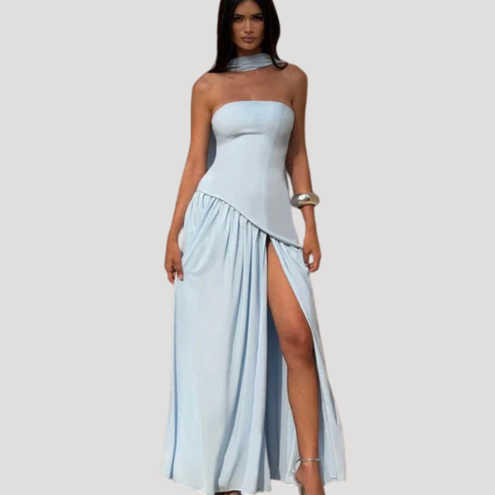 Modern women's long strapless pleated maxi dress, elegant party wear.