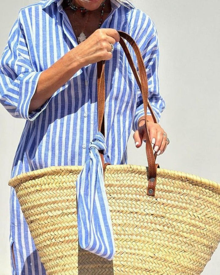 Stylish women's striped midi shirtdress. Button-down, elegant yet casual, with practical pockets for everyday wear.