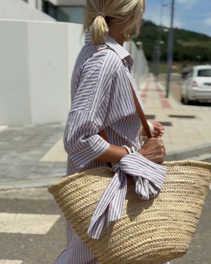 Comfortable striped midi shirtdress for women. Button-down design, versatile, and effortlessly chic with pockets.